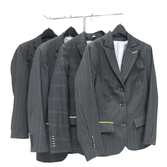 Metal rack displaying custom-tailored suits manufactured by American Stitchco, Inc., a contract sewing company specializing in apparel production.